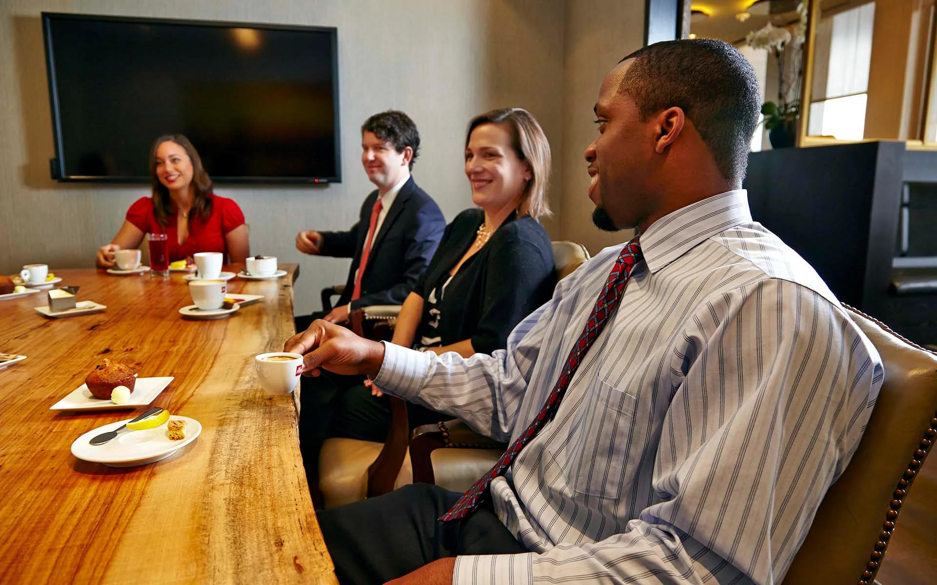 Elegant wellness lounge at Lifestyle Club Houston with members relaxing and socializing